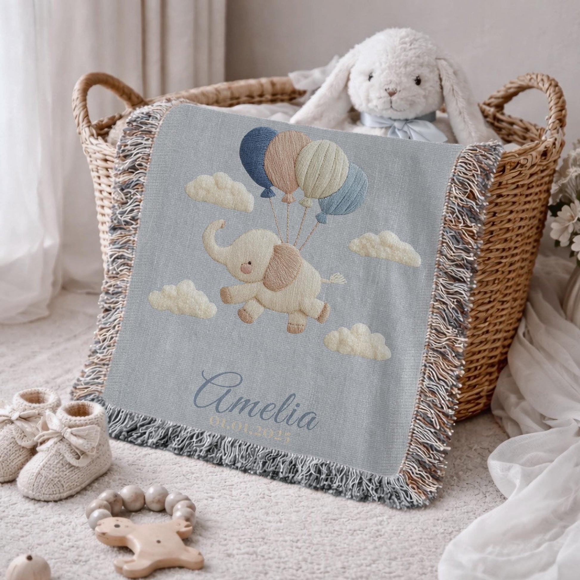 Personalized elephant woven blanket made from 100% cotton. A soft sky-themed nursery design featuring a baby elephant floating with balloons, woven in an embroidered-look finish — custom name and optional birth date included.