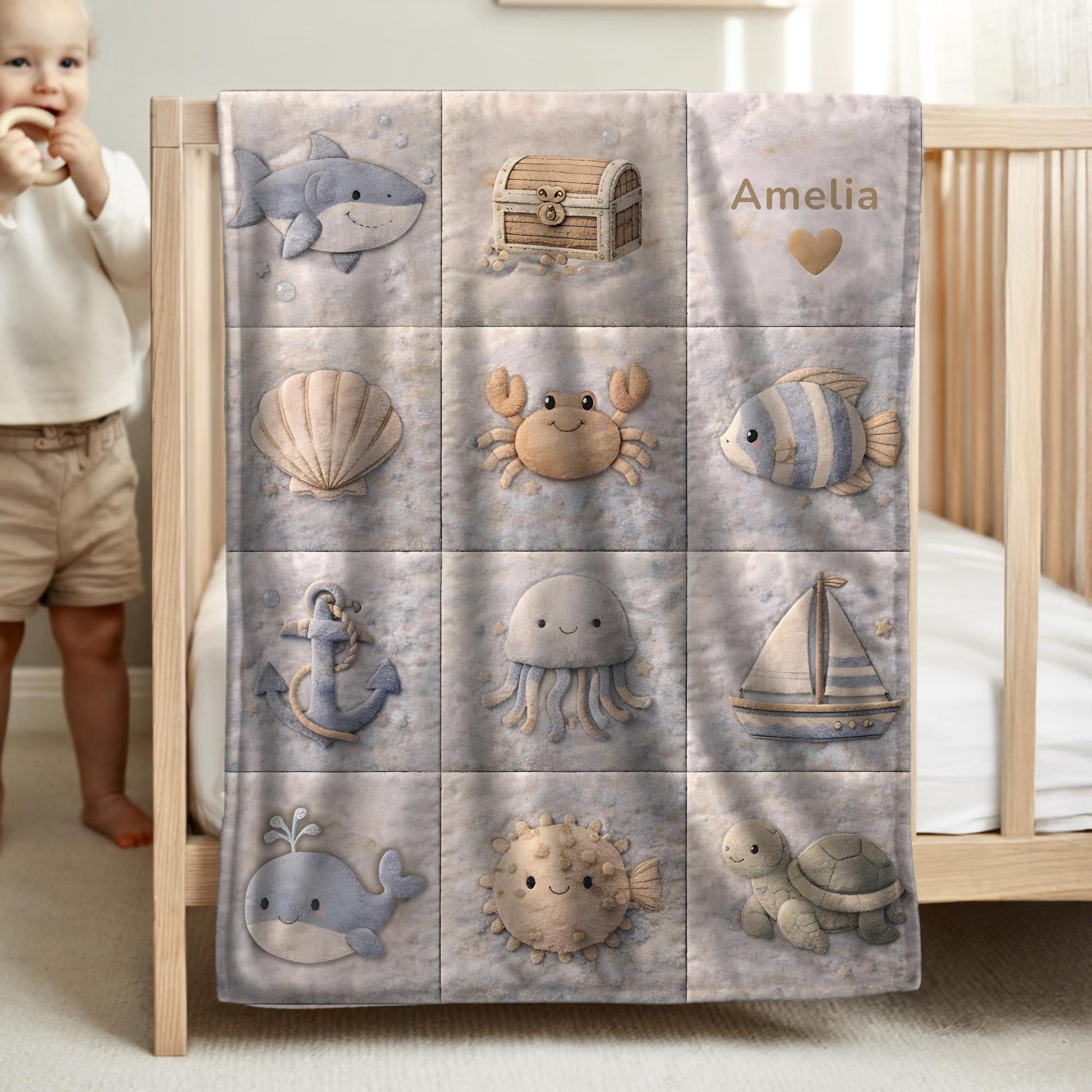 This personalized ocean baby quilt look blanket is custom made with your baby’s name and features a calm patchwork look in beige, sand and blue tones.