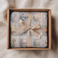 This personalized ocean baby quilt look blanket is custom made with your baby’s name and features a calm patchwork look in beige, sand and blue tones.