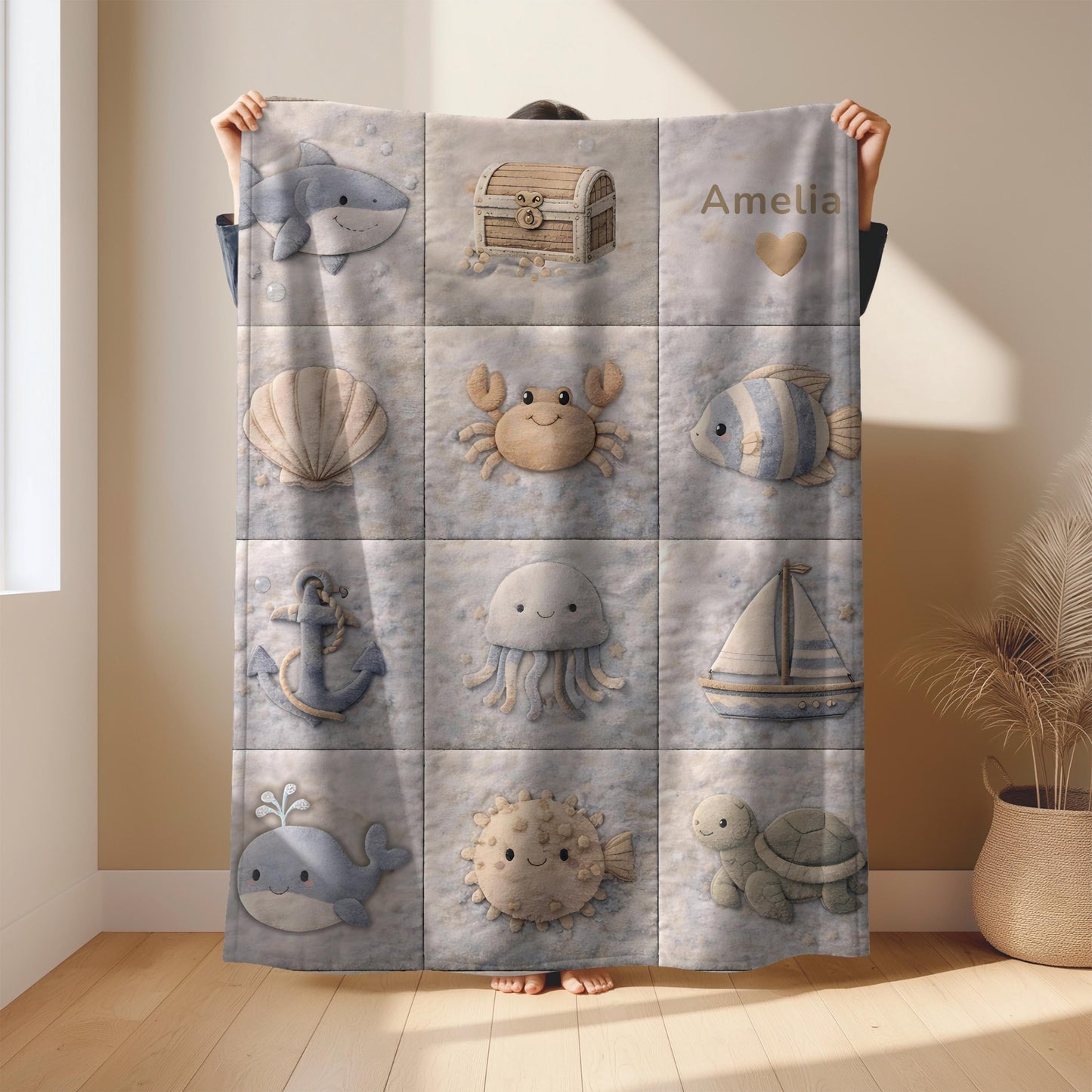 This personalized ocean baby quilt look blanket is custom made with your baby’s name and features a calm patchwork look in beige, sand and blue tones.