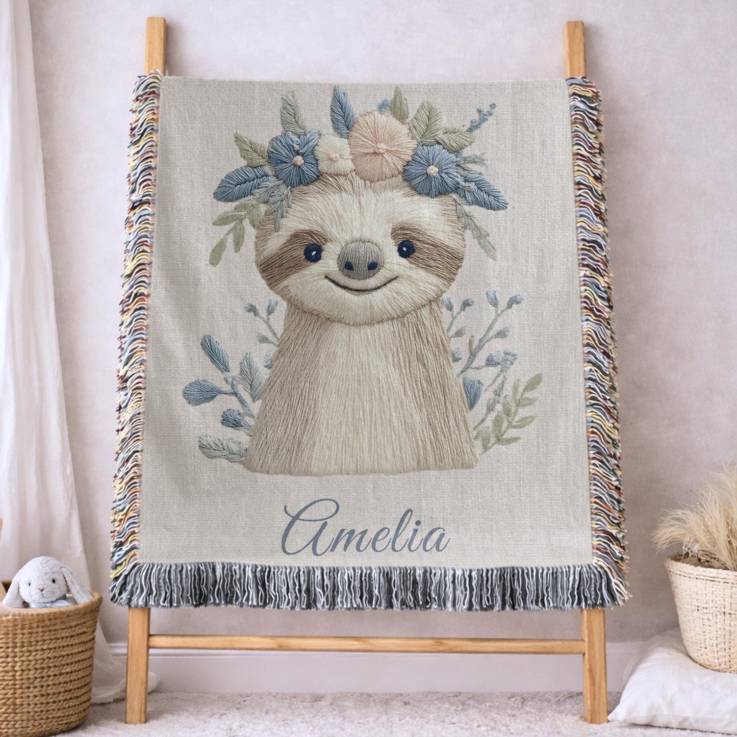 Woven cotton baby blanket with a calm sloth design. Personalized with name, neutral nursery decor and a timeless heirloom newborn gift.