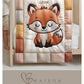 A timeless heirloom-style baby quilt featuring a woodland fox in an embroidered-look patchwork design. Soft neutral tones, perfect for nursery decor or a newborn gift.