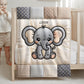 A personalized baby quilt blanket featuring a sweet elephant in an embroidered-look patchwork design. Soft neutral tones, perfect for nursery decor or a newborn gift.