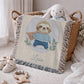 Personalized woven cotton baby blanket featuring a cute superhero sloth. Embroidered-look design, custom name, timeless nursery decor.