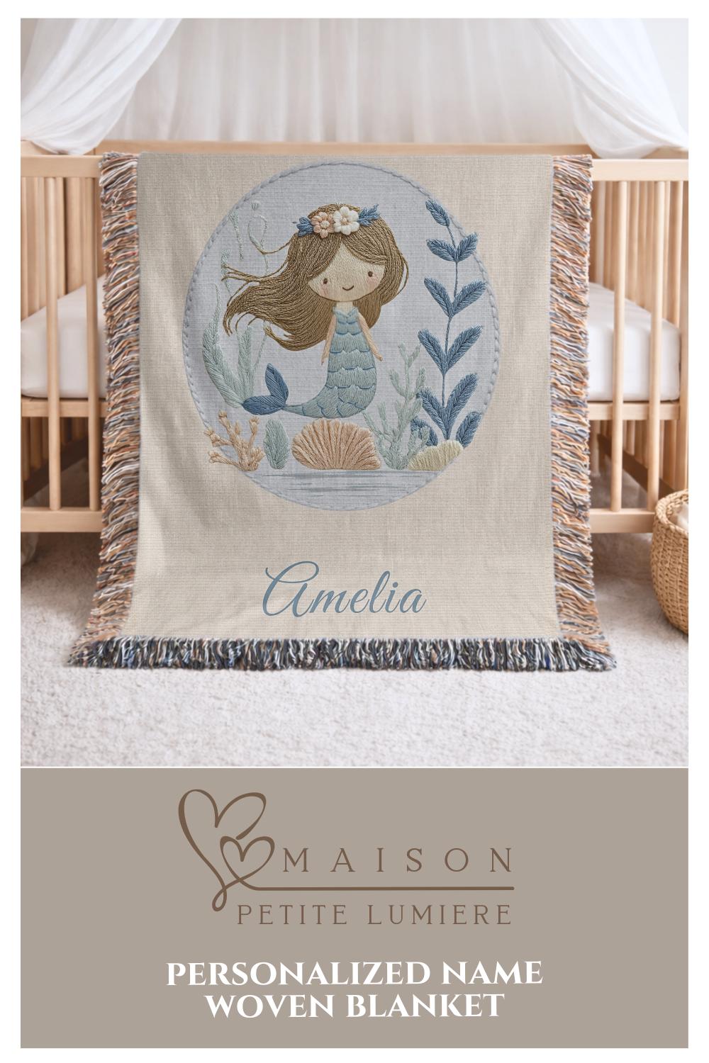Personalized woven baby blanket featuring a calm mermaid design. Ocean under the sea nursery decor, crafted as a soft cotton tapestry keepsake.