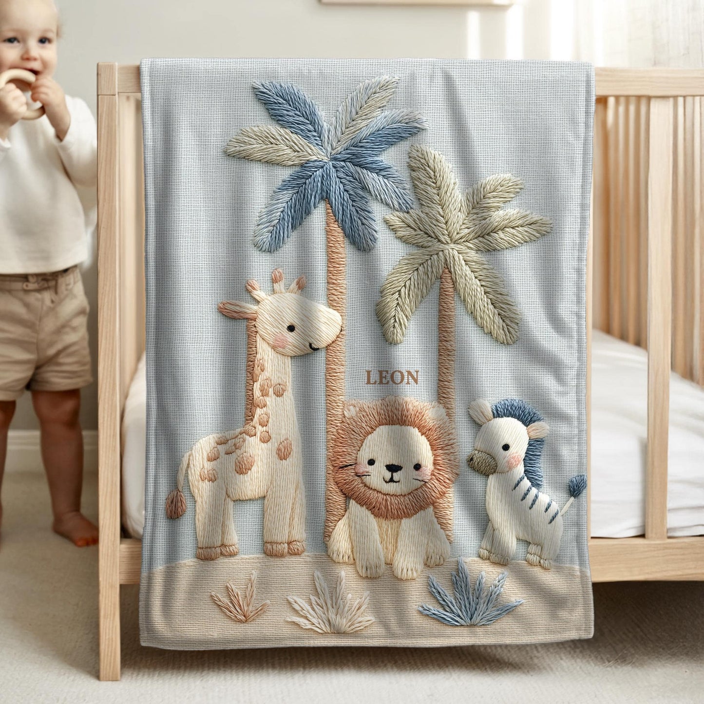 Personalized safari baby blanket with name featuring calm animal embroidered-look design in neutral tones. Timeless nursery decor and a thoughtful newborn gift.