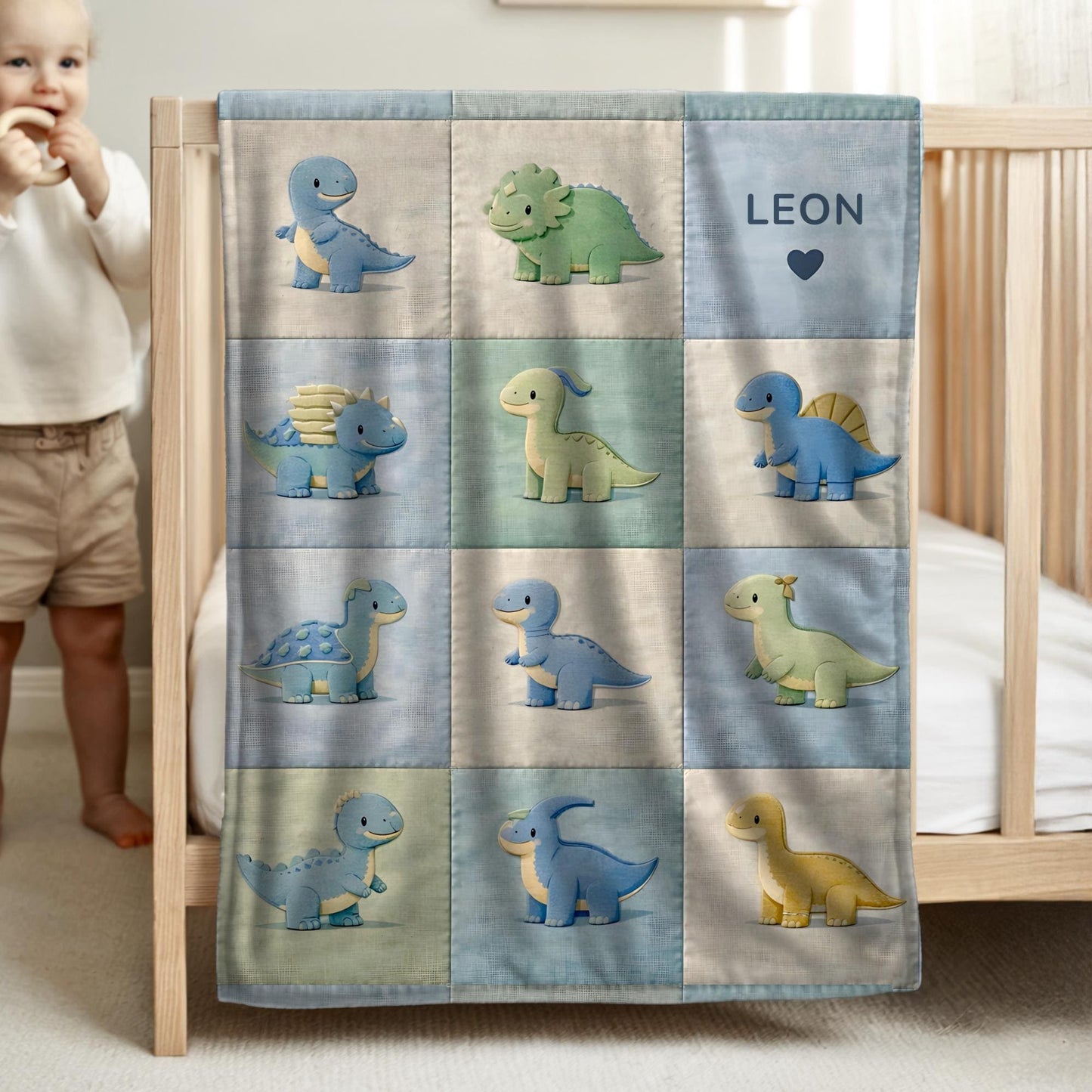 Personalized patchwork look baby blanket with cute dinosaurs in a soft quilt-style design. Neutral nursery colors with custom name panel.