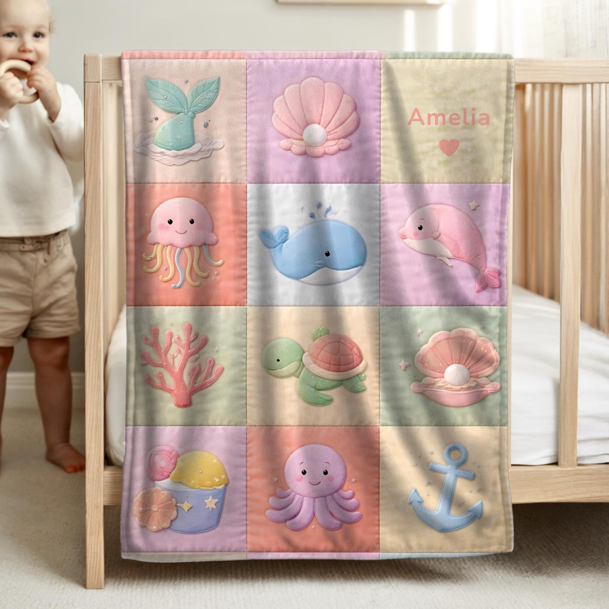 Personalized patchwork look baby blanket with mermaid and ocean animals in a soft quilt-style design. Pastel colors with custom name.