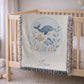 This personalized woven baby blanket features a gentle ocean theme with a sweet whale and fish design in a soft embroidered-look style.