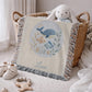 This personalized woven baby blanket features a gentle ocean theme with a sweet whale and fish design in a soft embroidered-look style.