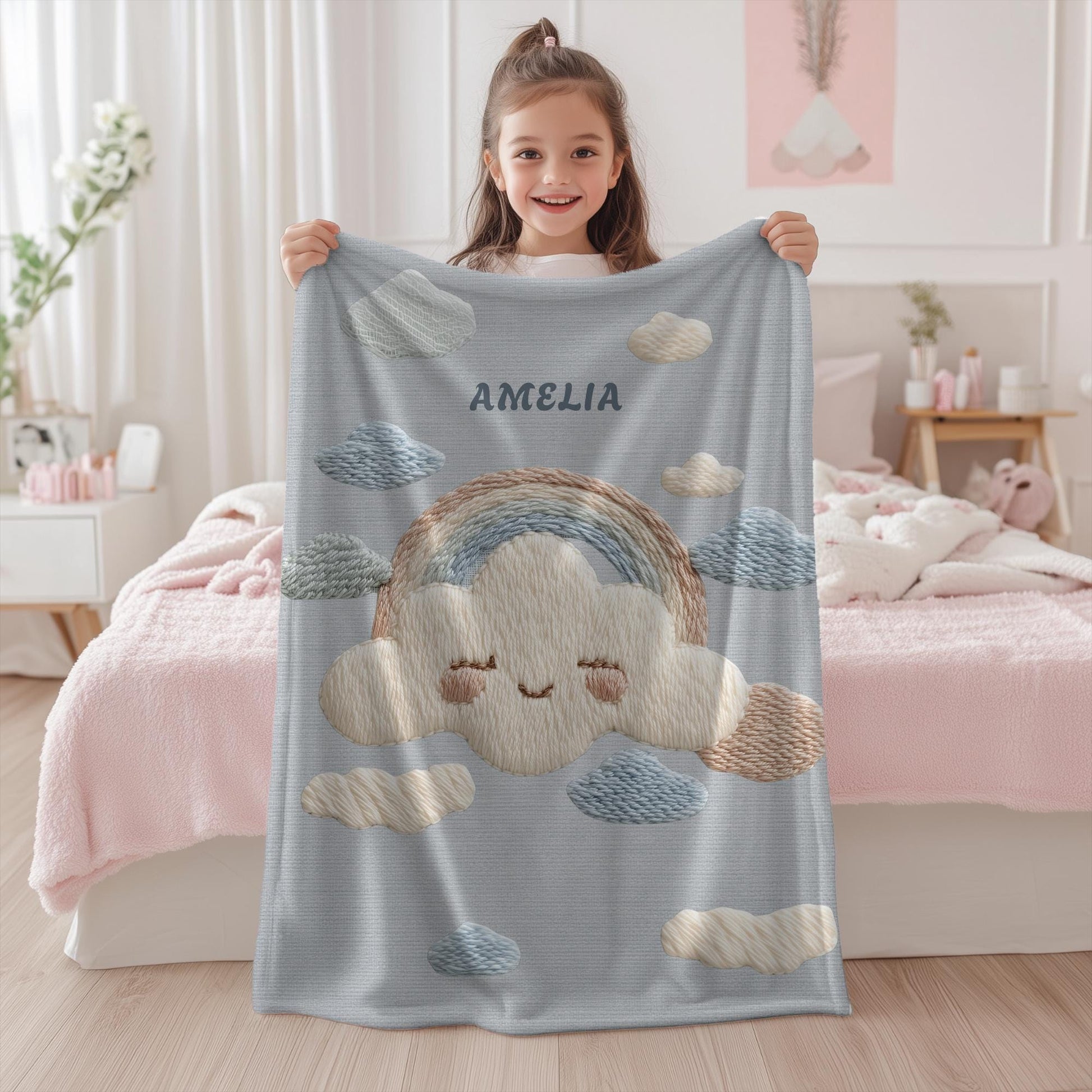 Personalized baby blanket with name in an embroidery look featuring a cloud with rainbow. Soft pastel tones – cozy velveteen or minky microfiber.