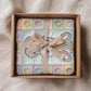 Personalized baby blanket with name in a patchwork quilt look featuring an Easter bunny. Soft pastel tones – velveteen, minky or sleeping bag.