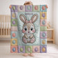 Personalized baby blanket with name in a patchwork quilt look featuring an Easter bunny. Soft pastel tones – velveteen, minky or sleeping bag.