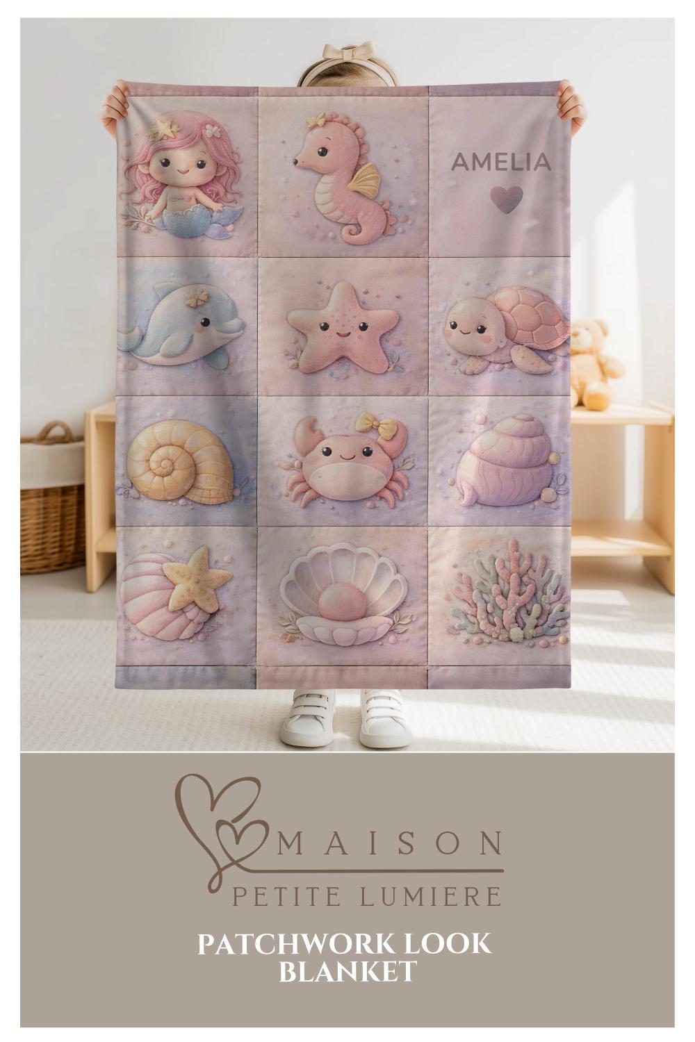 A personalized pink ocean baby quilt blanket with your baby’s name, designed in a soft patchwork look with gentle mermaid-inspired sea motifs.