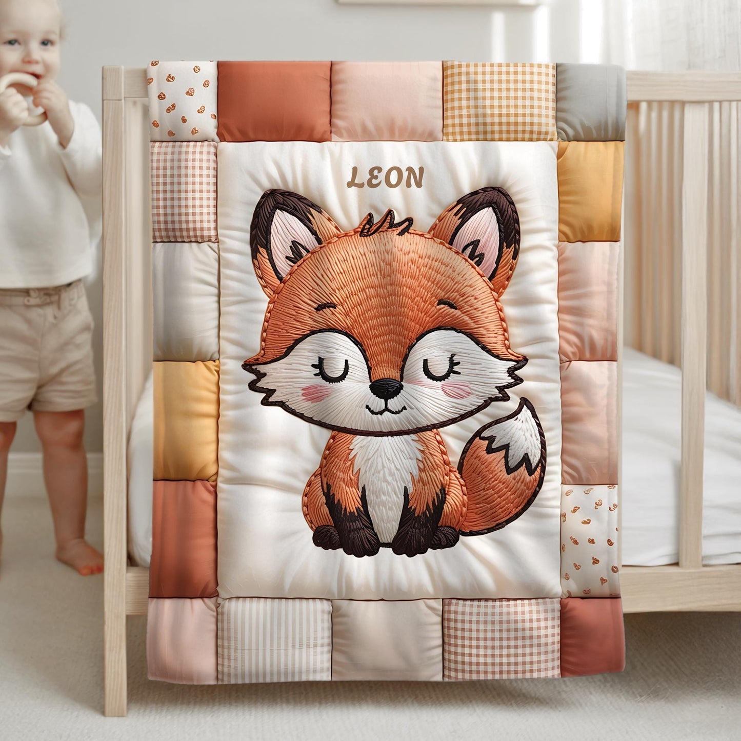 A timeless heirloom-style baby quilt featuring a woodland fox in an embroidered-look patchwork design. Soft neutral tones, perfect for nursery decor or a newborn gift.