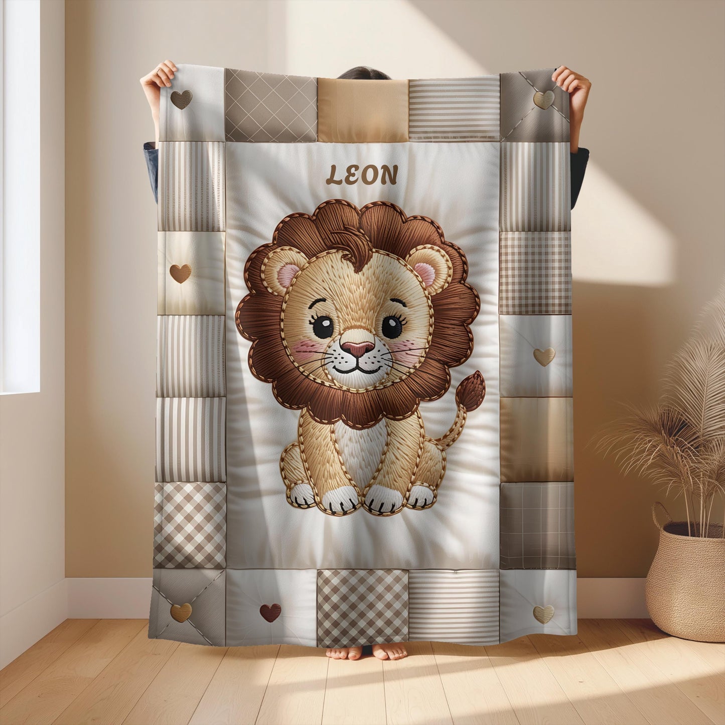 A personalized baby quilt blanket featuring a sweet lion in an heirloom-style patchwork look. Soft neutral tones – perfect for safari or neutral nurseries.