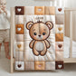 A personalized baby quilt blanket featuring a sweet teddy bear in an embroidered-look patchwork design. Soft neutral tones, perfect for nursery decor or a newborn gift.