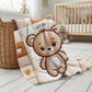 A personalized baby quilt blanket featuring a sweet teddy bear in an embroidered-look patchwork design. Soft neutral tones, perfect for nursery decor or a newborn gift.