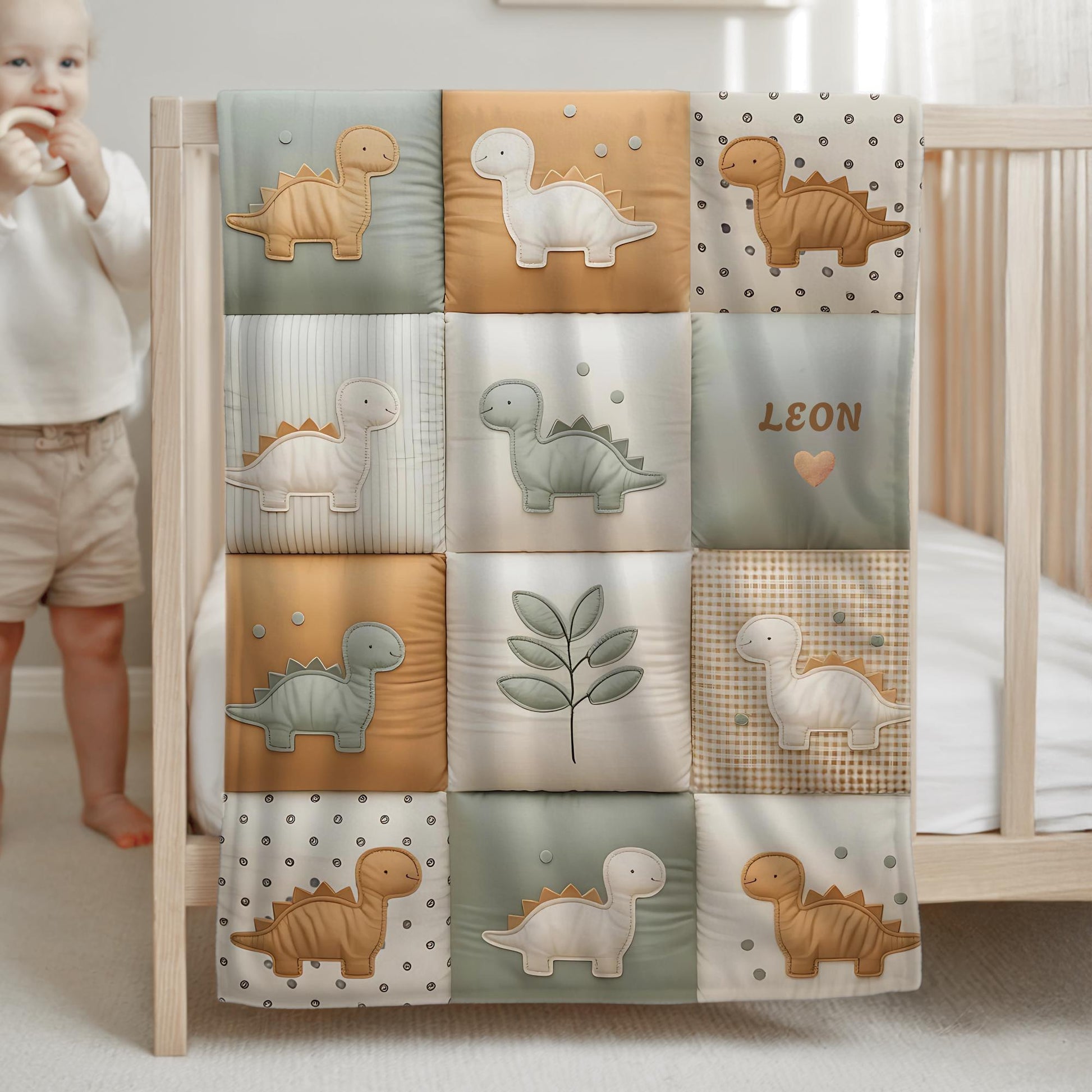 Personalized patchwork look baby blanket with name, featuring cute dinosaur motifs in a soft, neutral dino quilt design. A cozy newborn blanket and thoughtful baby gift.
