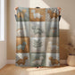 Personalized patchwork look baby blanket with name, featuring cute dinosaur motifs in a soft, neutral dino quilt design. A cozy newborn blanket and thoughtful baby gift.