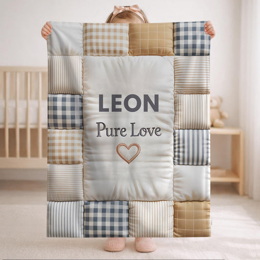 Personalized baby quilt blanket featuring your baby’s name and the quote “Pure Love” in a soft, neutral patchwork design. A cozy newborn blanket and meaningful keepsake gift.