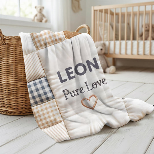 Personalized baby quilt blanket featuring your baby’s name and the quote “Pure Love” in a soft, neutral patchwork design. A cozy newborn blanket and meaningful keepsake gift.
