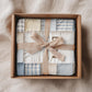 Personalized baby blanket with name in a soft patchwork quilt look. Neutral, lightweight and cozy – a timeless newborn or baby shower gift.