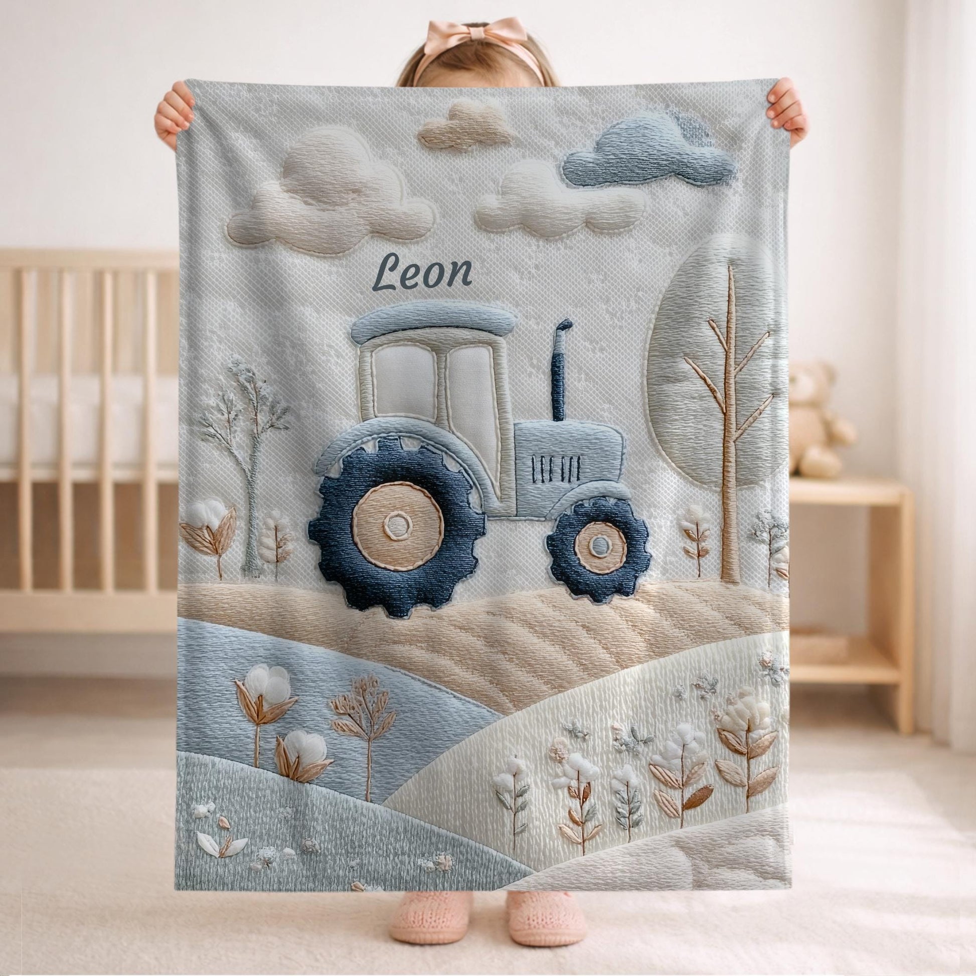 Personalized Traktor baby blanket with name - embroidered look details in soft neutral colors. A cozy newborn blanket and timeless boutique baby gift.