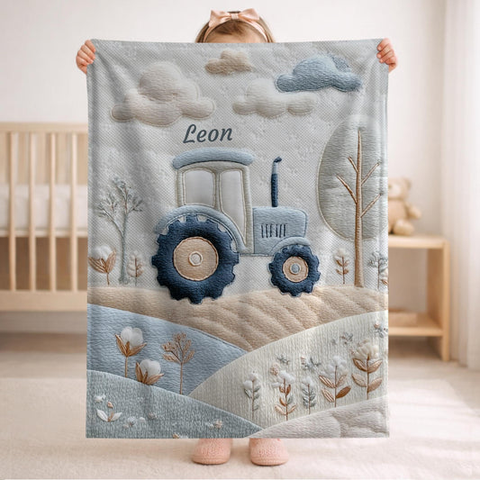 Personalized Traktor baby blanket with name - embroidered look details in soft neutral colors. A cozy newborn blanket and timeless boutique baby gift.