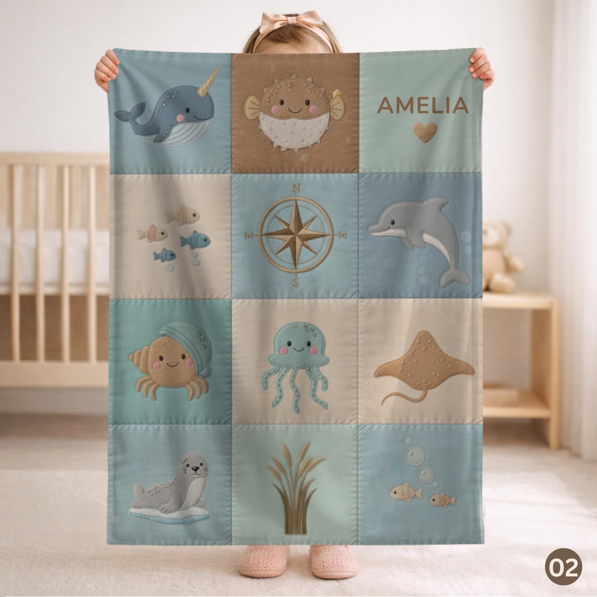 Personalized patchwork look baby blanket with name, crab, whale and octopus in a soft underwater quilt design. Cozy newborn blanket and baby gift.