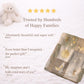 Personalized patchwork look baby blanket with clouds, sun, moon and stars in a soft quilt-style design. Neutral nursery colors with custom name.