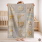 Personalized patchwork look baby blanket with clouds, sun, moon and stars in a soft quilt-style design. Neutral nursery colors with custom name.