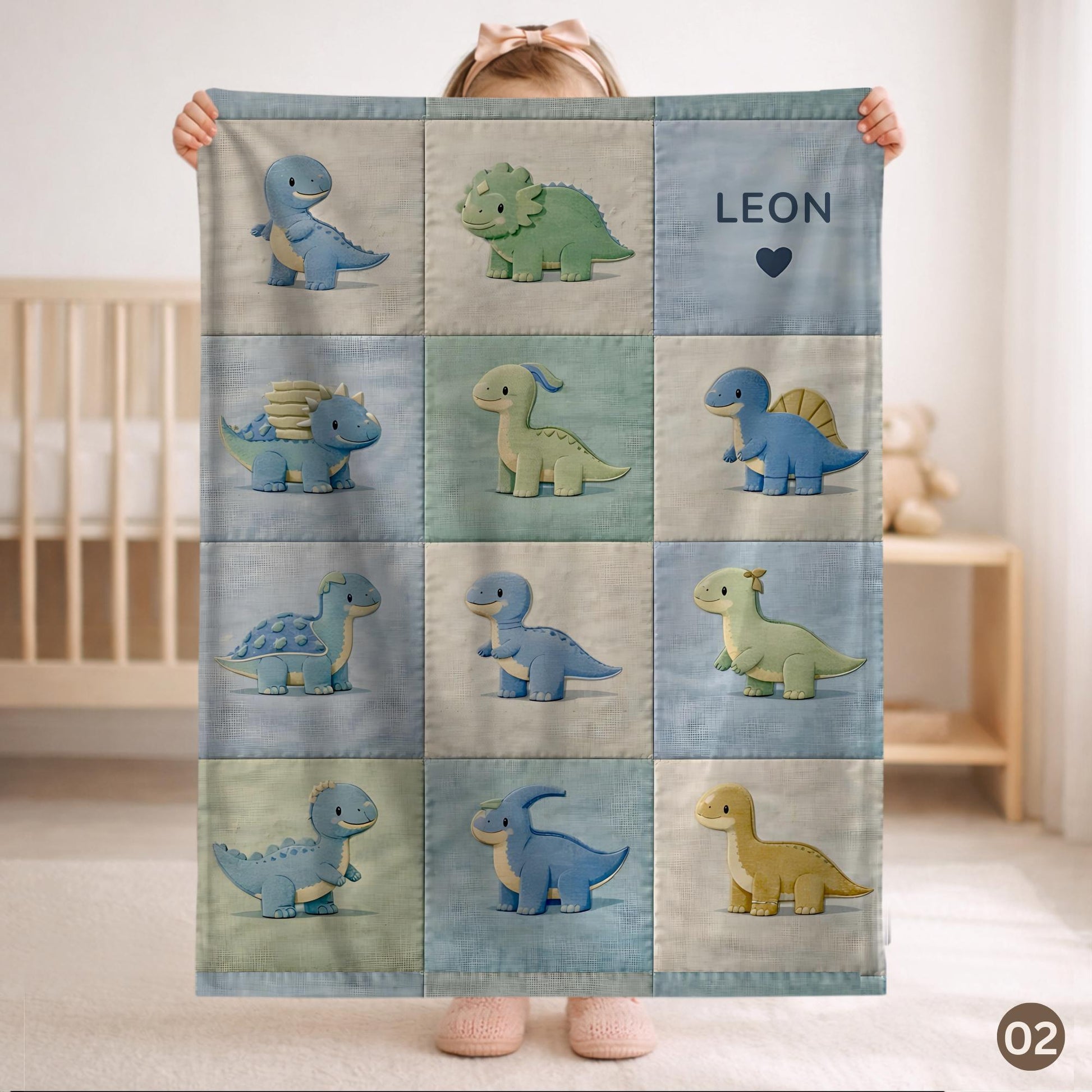 Personalized patchwork look baby blanket with cute dinosaurs in a soft quilt-style design. Neutral nursery colors with custom name panel.