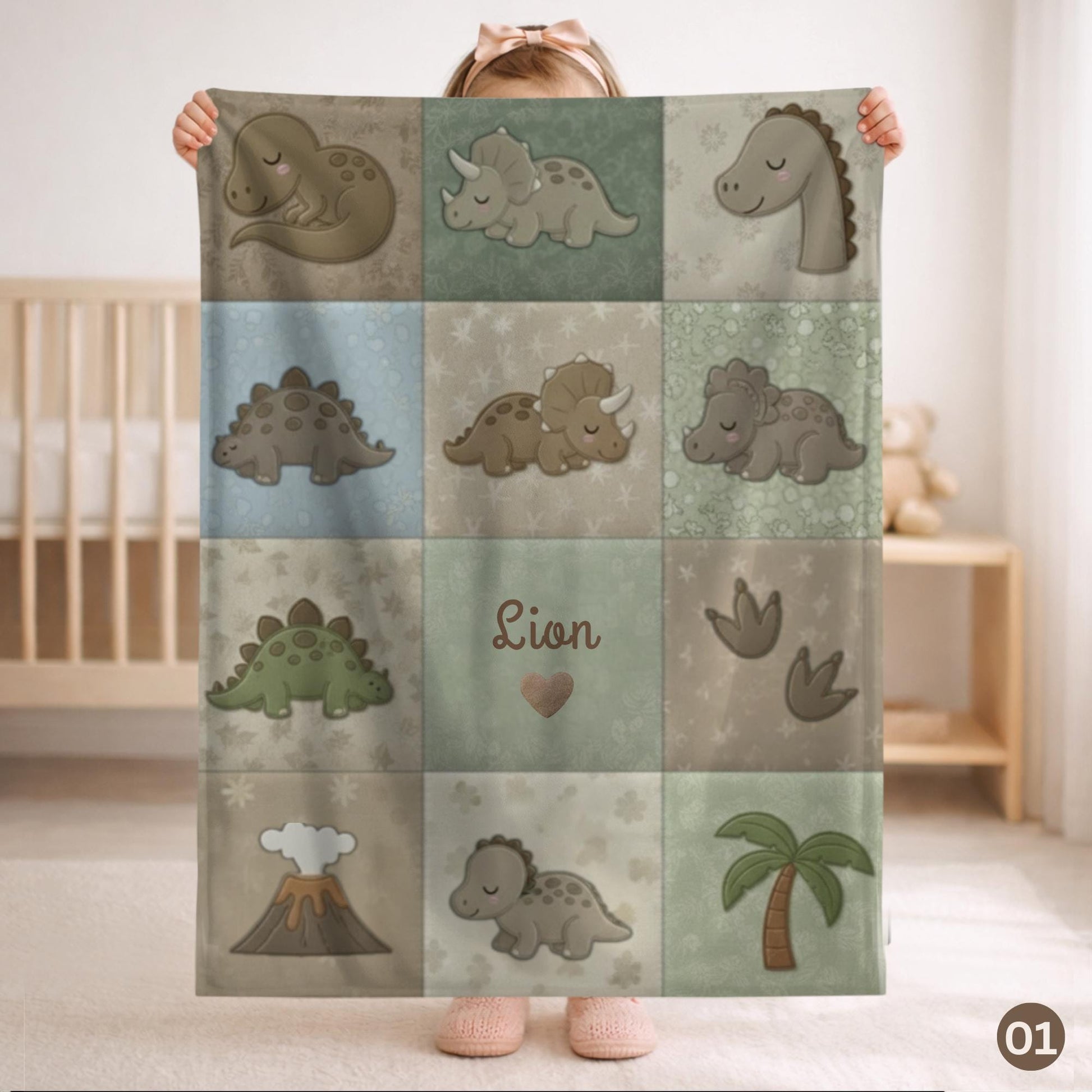 Personalized patchwork look baby blanket with cute dinosaurs in a soft quilt-style design. Neutral nursery colors with custom name panel.