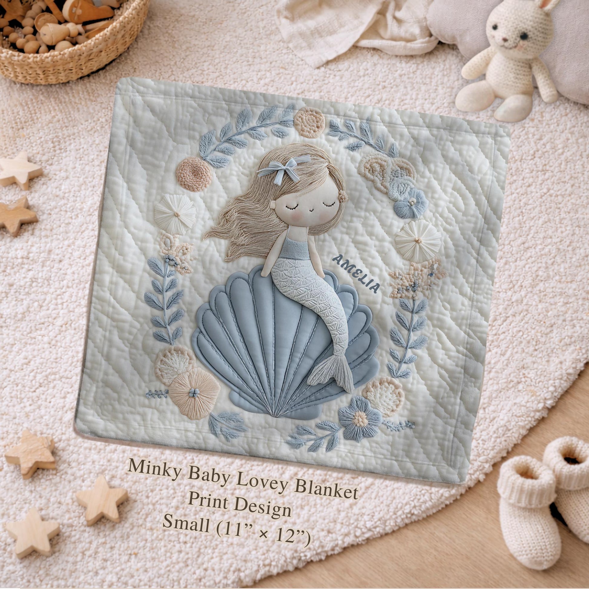 Soft embroidered-look mermaid baby blanket with a calm mermaid seashell design and pastel florals. Neutral tones, cozy fabric — a boutique newborn gift for serene, modern nursery decor.