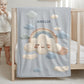 Personalized baby blanket with name in an embroidery look featuring a cloud with rainbow. Soft pastel tones – cozy velveteen or minky microfiber.