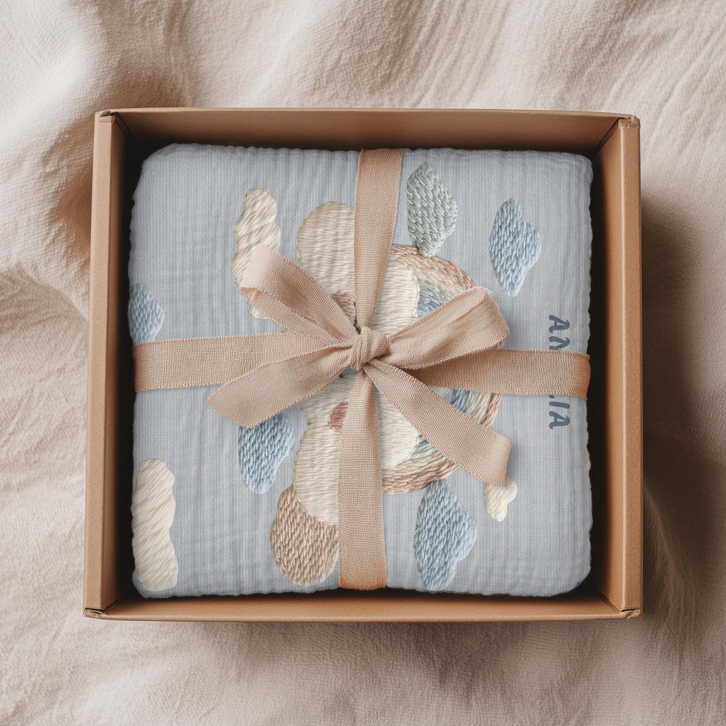 Personalized baby blanket with name in an embroidery look featuring a cloud with rainbow. Soft pastel tones – cozy velveteen or minky microfiber.