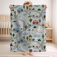 Personalized embroidered look baby blanket with stitched cars and winding streets. Soft vehicle themed nursery decor and unique baby gift.