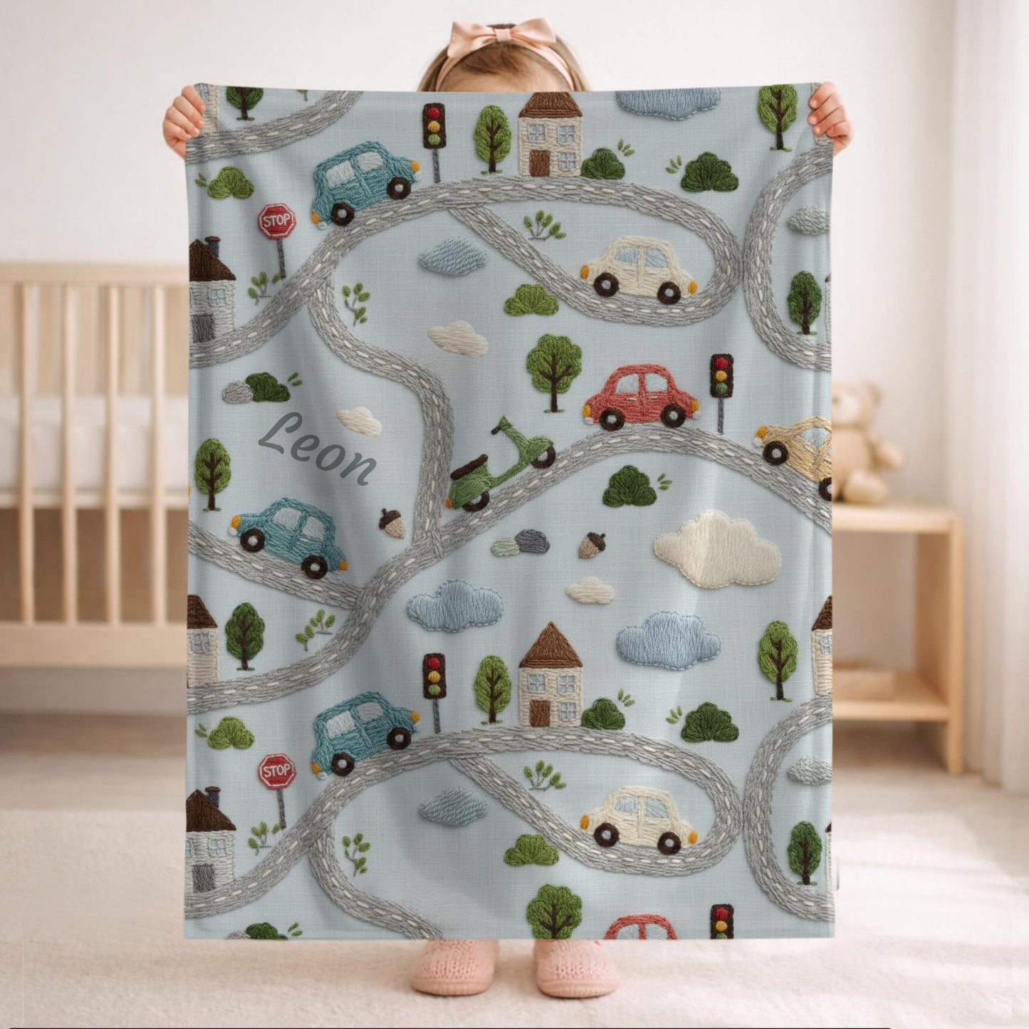 Personalized embroidered look baby blanket with stitched cars and winding streets. Soft vehicle themed nursery decor and unique baby gift.