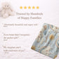 Personalized baby blanket in stitched look with dreamy clouds and rainbow. Soft neutral nursery decor and unique baby shower gift.