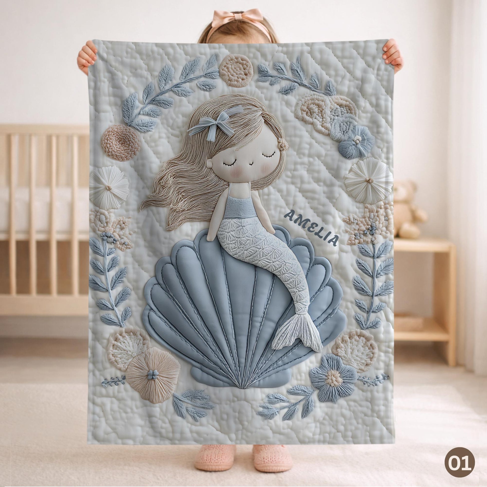 Soft embroidered-look mermaid baby blanket with a calm mermaid seashell design and pastel florals. Neutral tones, cozy fabric — a boutique newborn gift for serene, modern nursery decor.