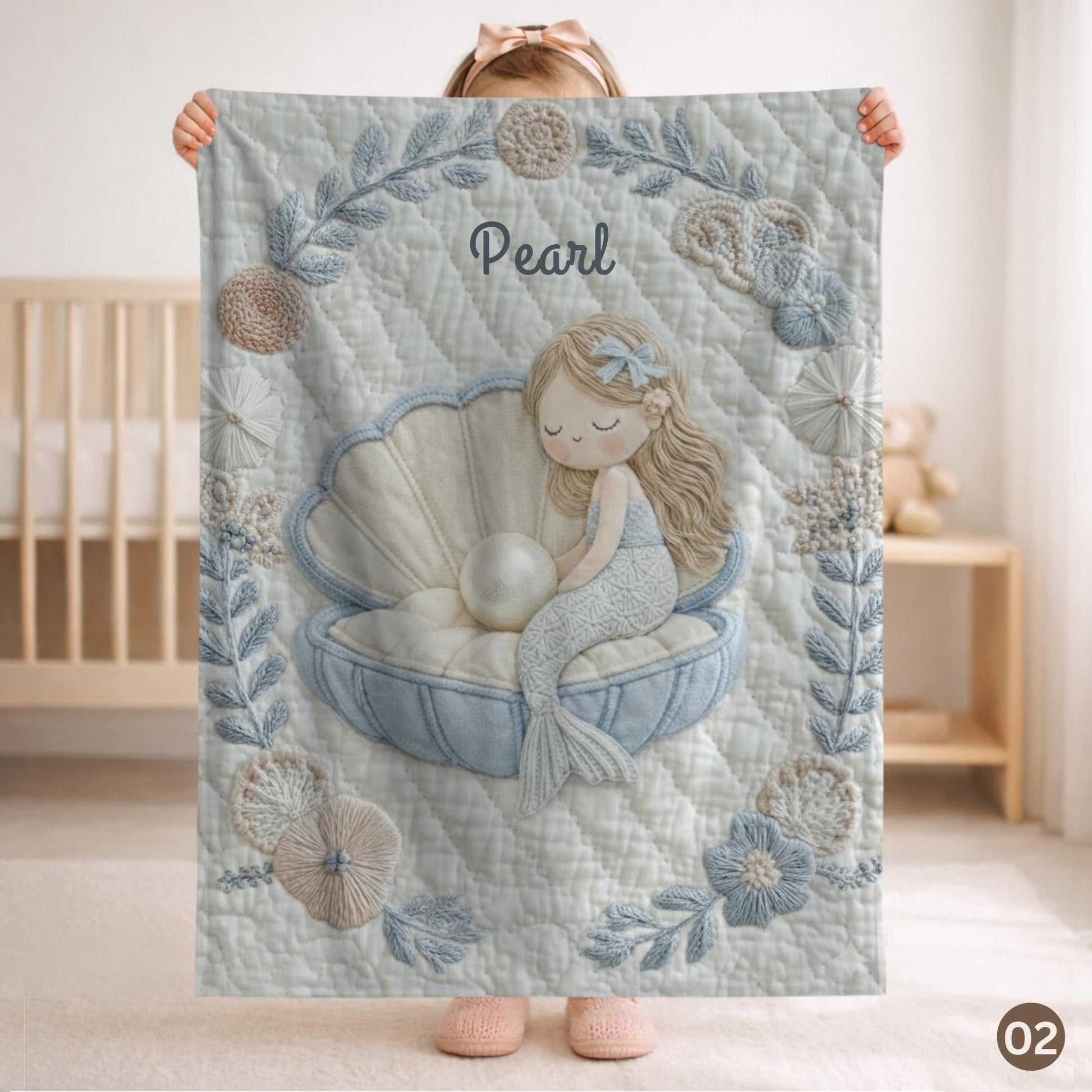 Soft embroidered-look mermaid baby blanket with a calm mermaid seashell design and pastel florals. Neutral tones, cozy fabric — a boutique newborn gift for serene, modern nursery decor.
