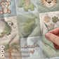 Personalized botanical safari baby blanket with name in embroidered quilt look. Soft greenery design for neutral nursery decor and timeless baby gift.