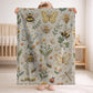 Garden baby blanket in embroidered quilt look. Butterfly and bee botanical design for neutral nursery decor and baby gift.