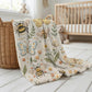 Garden baby blanket in embroidered quilt look. Butterfly and bee botanical design for neutral nursery decor and baby gift.