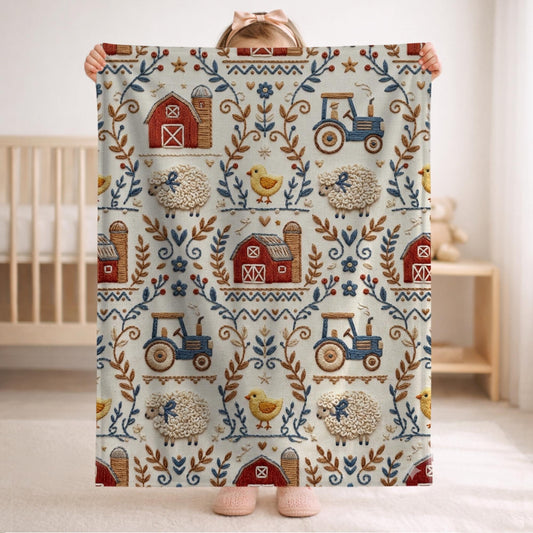 Embroidery Look farm baby blanket in embroidered quilt look. Tractor, barn and sheep design for neutral nursery decor and baby gift.