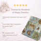 Personalized baby blanket in a patchwork look with horse and farm motifs in calm neutral tones. Printed quilt style for cozy modern nurseries.