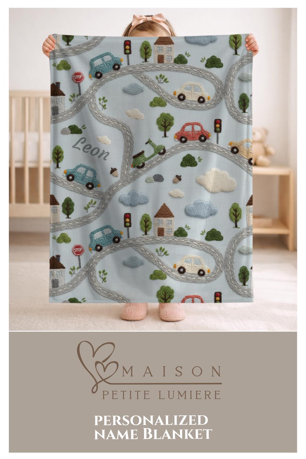 Personalized embroidered look baby blanket with stitched cars and winding streets. Soft vehicle themed nursery decor and unique baby gift.