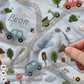 Personalized embroidered look baby blanket with stitched cars and winding streets. Soft vehicle themed nursery decor and unique baby gift.