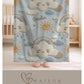 Personalized baby blanket in stitched look with dreamy clouds and rainbow. Soft neutral nursery decor and unique baby shower gift.